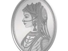 a silver coin with a woman's face on it