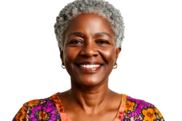 an older woman with grey hair smiling at the camera