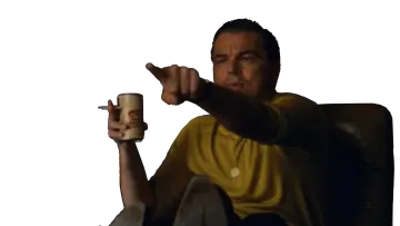 a man sitting in a chair holding a cup