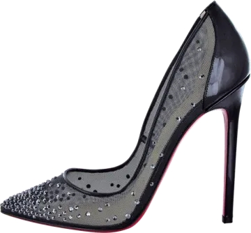 a pair of black and silver shoes with spikes