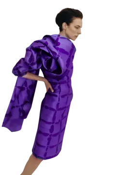 a woman in a purple dress and black shoes