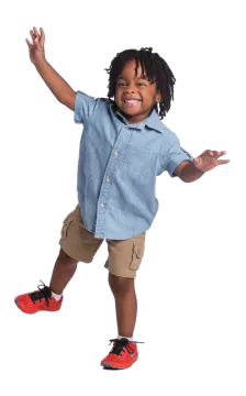 a little boy is jumping in the air