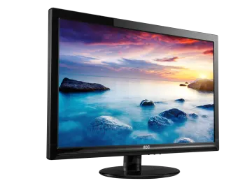 a computer monitor with a sunset in the background