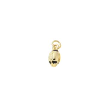 a gold plated charm with a black and white bea