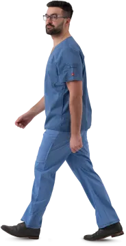 a man in scrubs walking on a white background