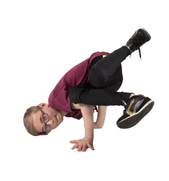 a young boy doing a trick on a skateboard