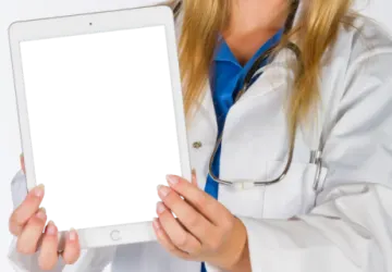 a woman in a white lab coat holding a tablet