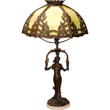 a table lamp with a woman holding an umbrella