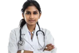 a female doctor standing with her arms crossed
