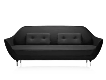 a black sofa with two pillows on it
