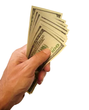 a person's hand holding a bunch of money