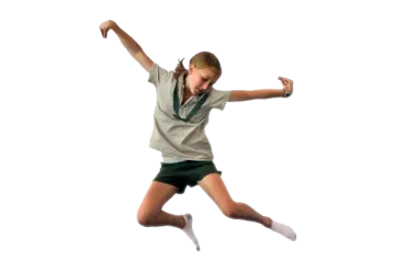 a young girl is jumping in the air