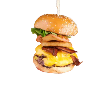 a close up of a hamburger with bacon and cheese