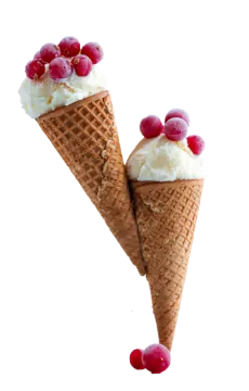 two cones of ice cream with rass on top