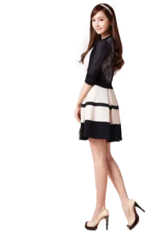 a woman wearing a black and white dress