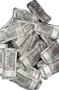 a pile of hundred dollar bills