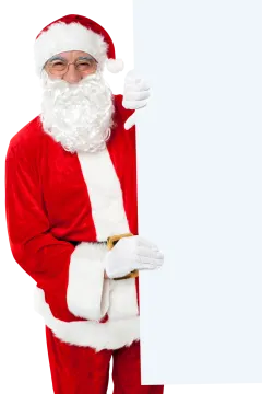 a man dressed as santa claus holding a sign