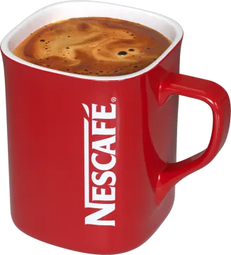 a red coffee mug with the word nes on it