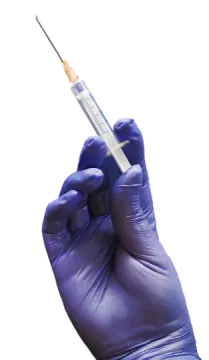 a hand in blue gloves holding a sy