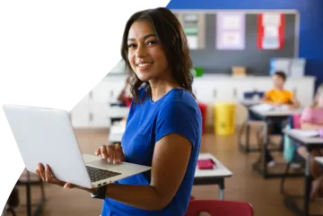 a woman holding a laptop computer