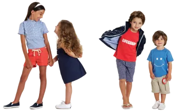 a group of young children standing next to each other kids