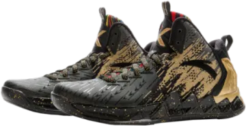 a pair of black and gold basketball shoes