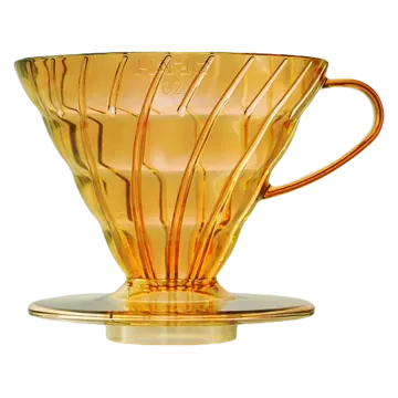 a yellow glass coffee driper on a white background