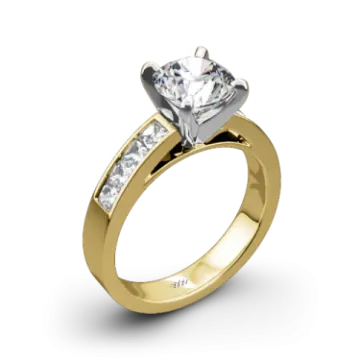 a yellow gold engagement ring with a single diamond