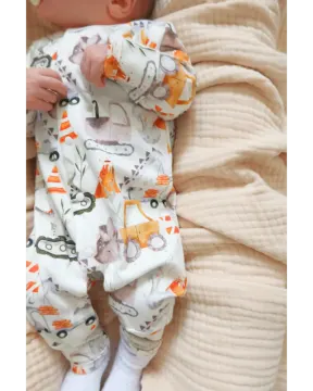 a baby laying on top of a blanket