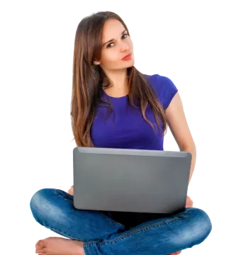 a woman sitting on the floor with her laptop
