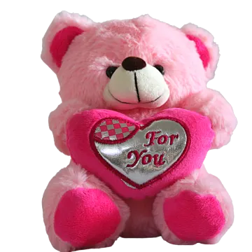 a pink teddy bear holding a heart