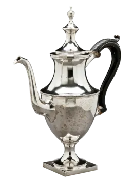 an antique silver coffee pot on a stand