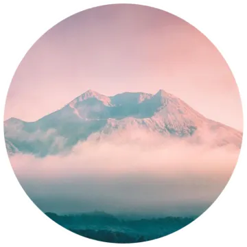 an image of a mountain covered in fog