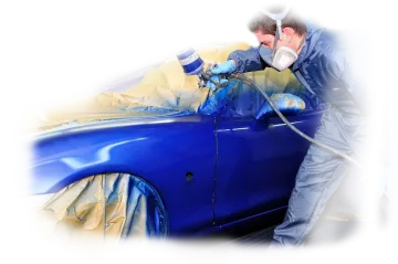 a man painting a blue car
