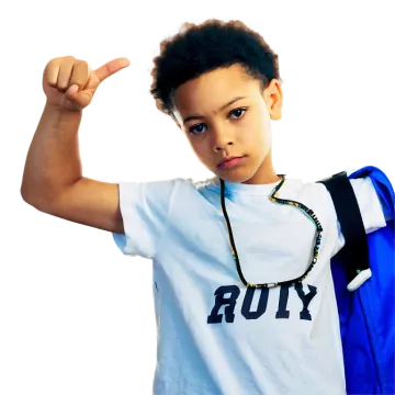 a young boy with a backpack pointing at the camera