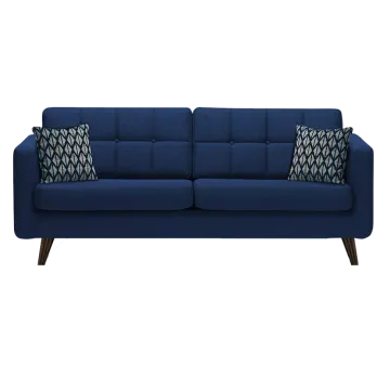 a blue couch with two pillows on it