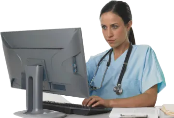 a woman sitting at a desk with a computer