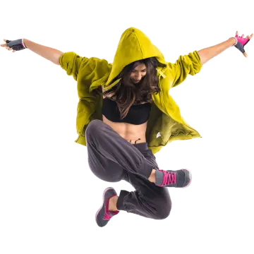 a woman jumping in the air while wearing a hoodie