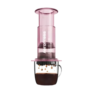 a glass coffee maker with the lid open