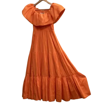 an orange dress on a hanger