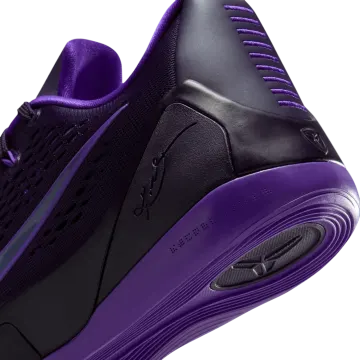 a close up view of the nike zoom zoom basketball shoe in purple and black