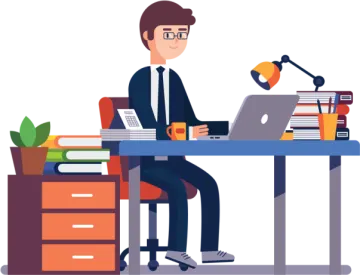 a man sitting at his desk and working on a laptop