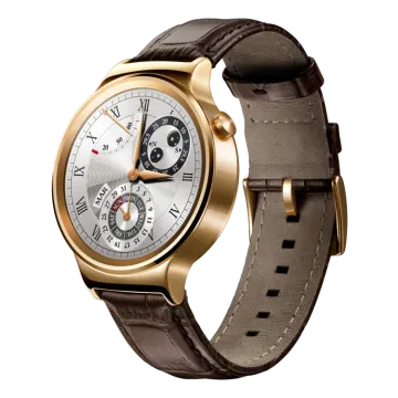 a gold watch with brown leather strap
