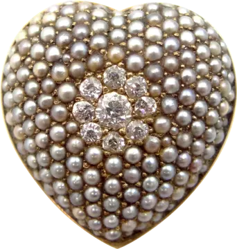 a heart shaped pearl and diamond ring