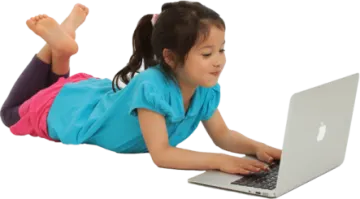 a little girl laying on the floor with her laptop