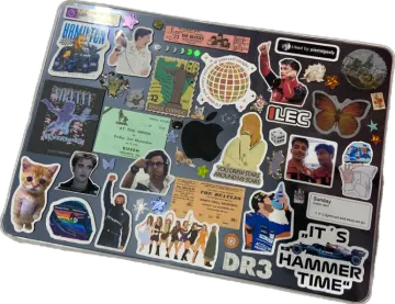 a laptop with many stickers on it
