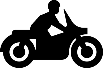 a silhouette of a person riding a motorcycle