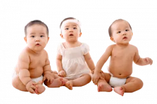 three babies sitting side by side on a white background