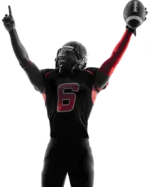 a football player with his arms in the air