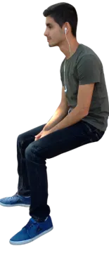 a man is sitting down with his headphones on
